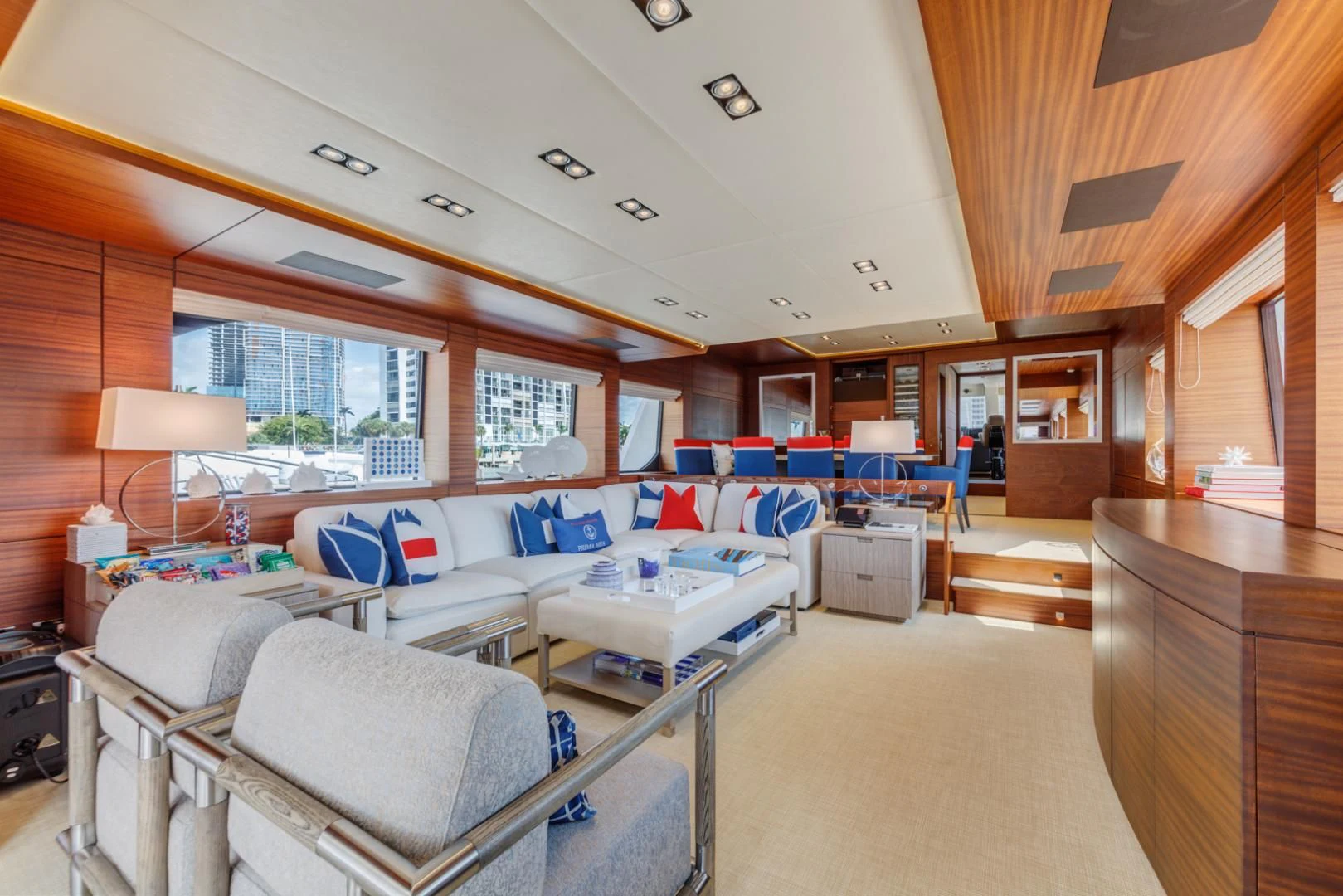 a room with a couch and a table aboard PRIMA MEA Yacht for Sale