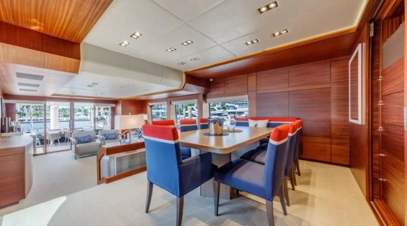 a room with a table and chairs aboard PRIMA MEA Yacht for Sale