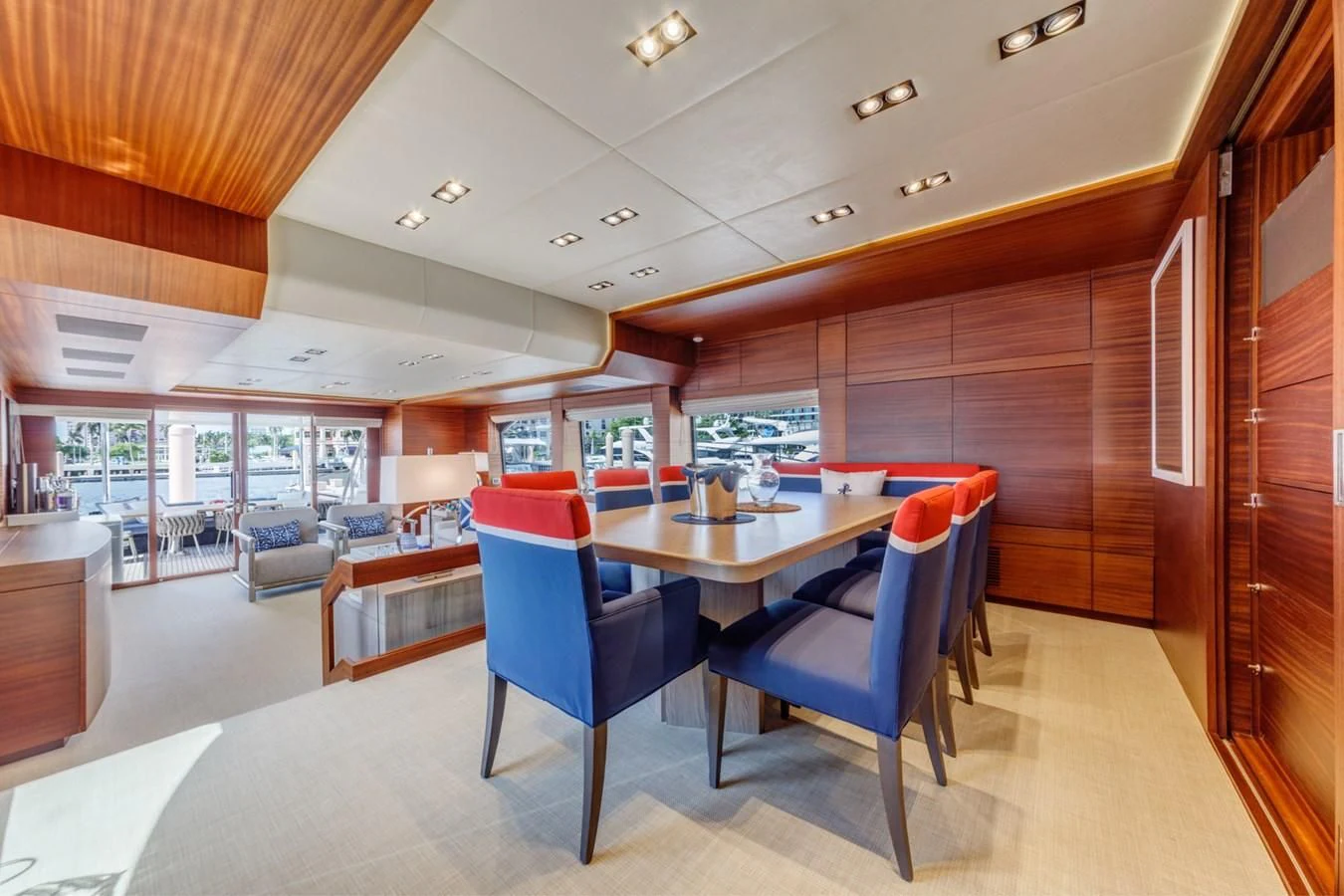 a large room with a table and chairs aboard PRIMA MEA Yacht for Sale