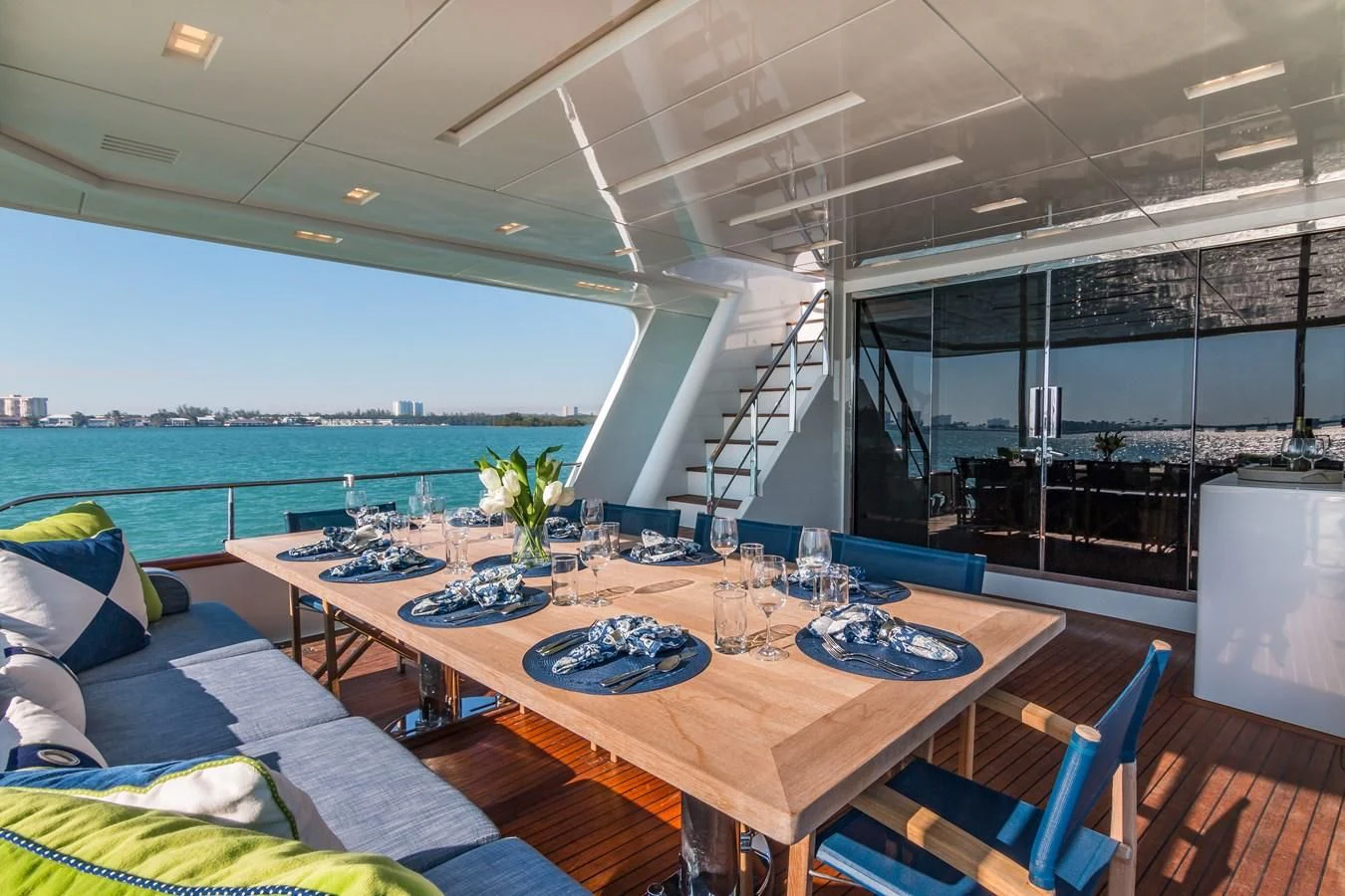 a large table with chairs around it aboard PRIMA MEA Yacht for Sale