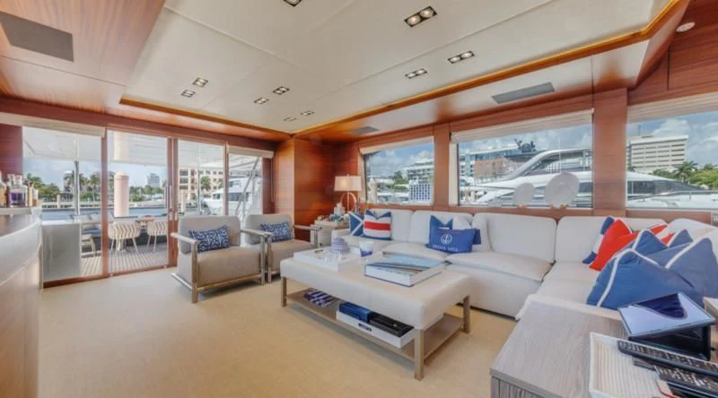 a living room with a large window aboard PRIMA MEA Yacht for Sale