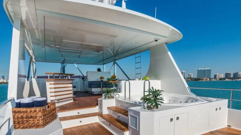a large white building with a balcony overlooking a body of water aboard PRIMA MEA Yacht for Sale
