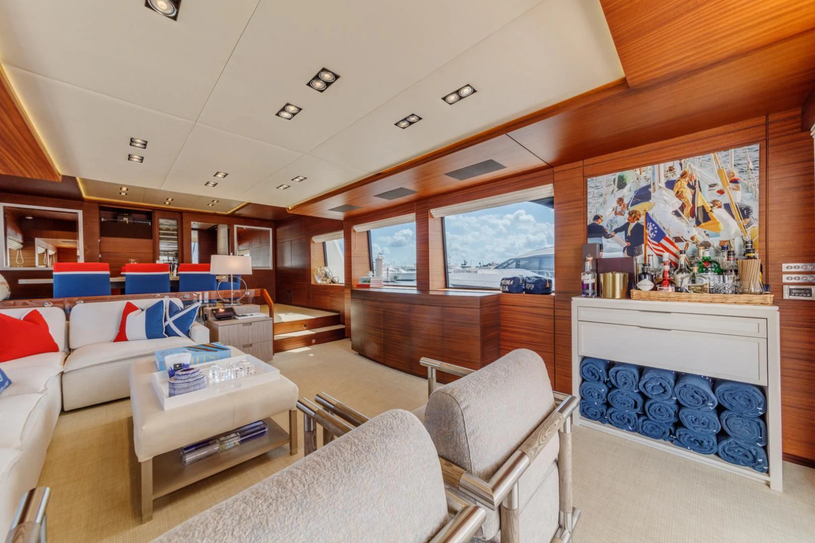 a room with a couch and a table and chairs aboard PRIMA MEA Yacht for Sale