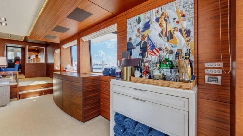 a kitchen with a large painting aboard PRIMA MEA Yacht for Sale
