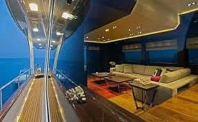 a large room with a balcony aboard PRIMA MEA Yacht for Sale