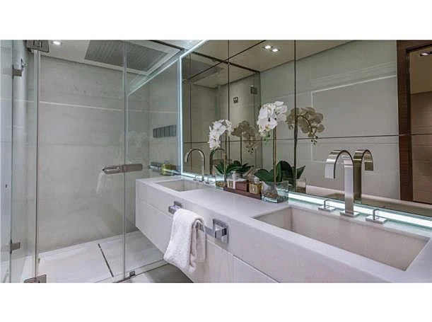 a bathroom with a large mirror aboard PRIMA MEA Yacht for Sale