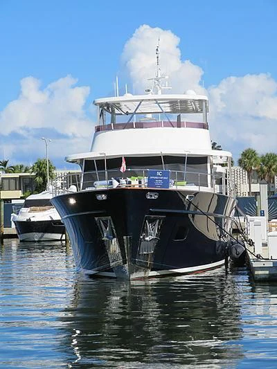 a large boat is parked in the water aboard PRIMA MEA Yacht for Sale