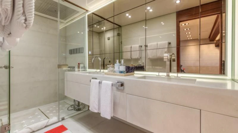 a bathroom with a large mirror aboard PRIMA MEA Yacht for Sale