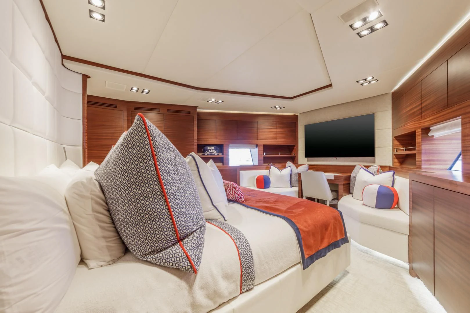 a room with a bed and a television aboard PRIMA MEA Yacht for Sale