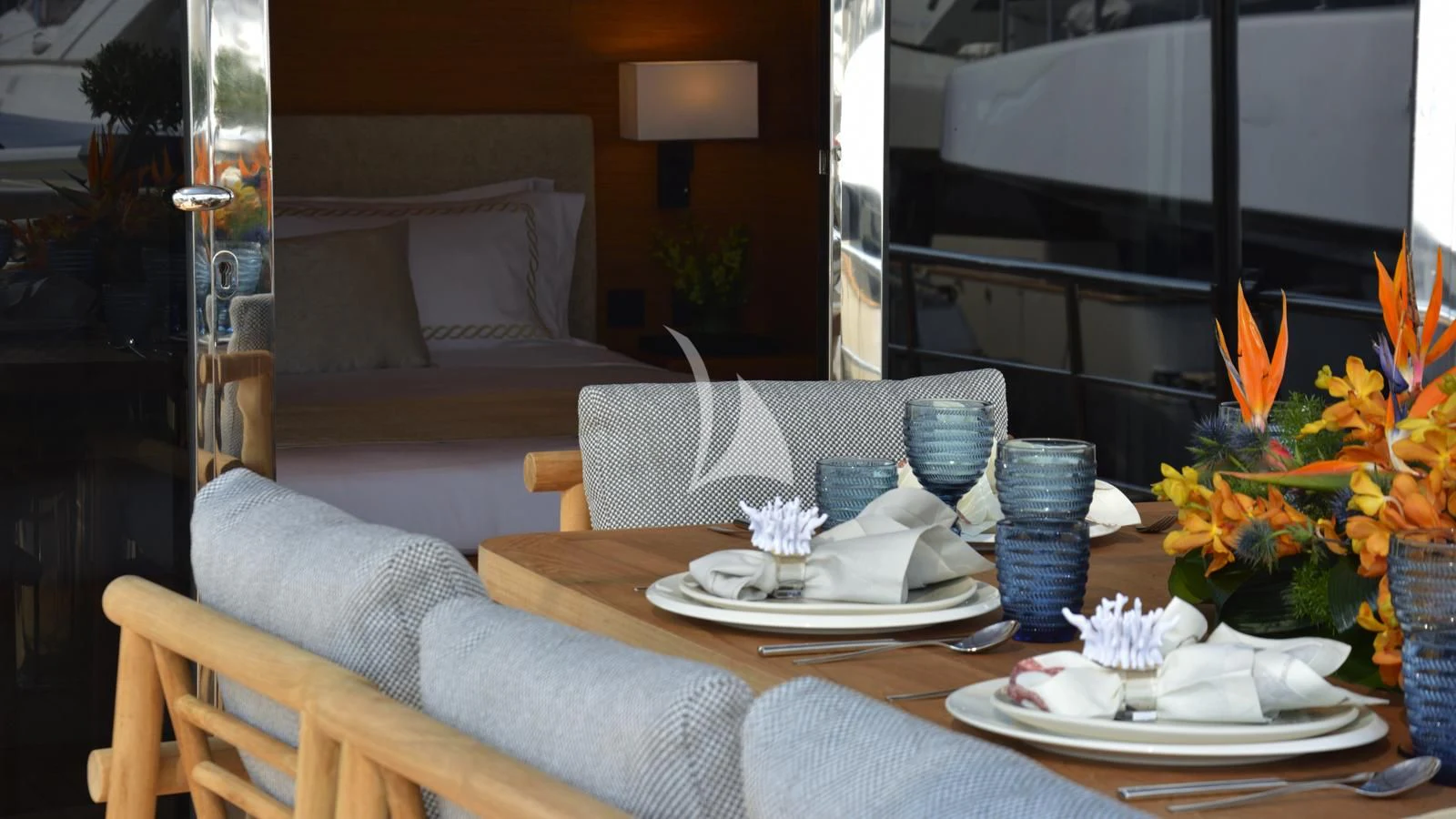 a table with plates and cups on it aboard XIPHIAS Yacht for Charter