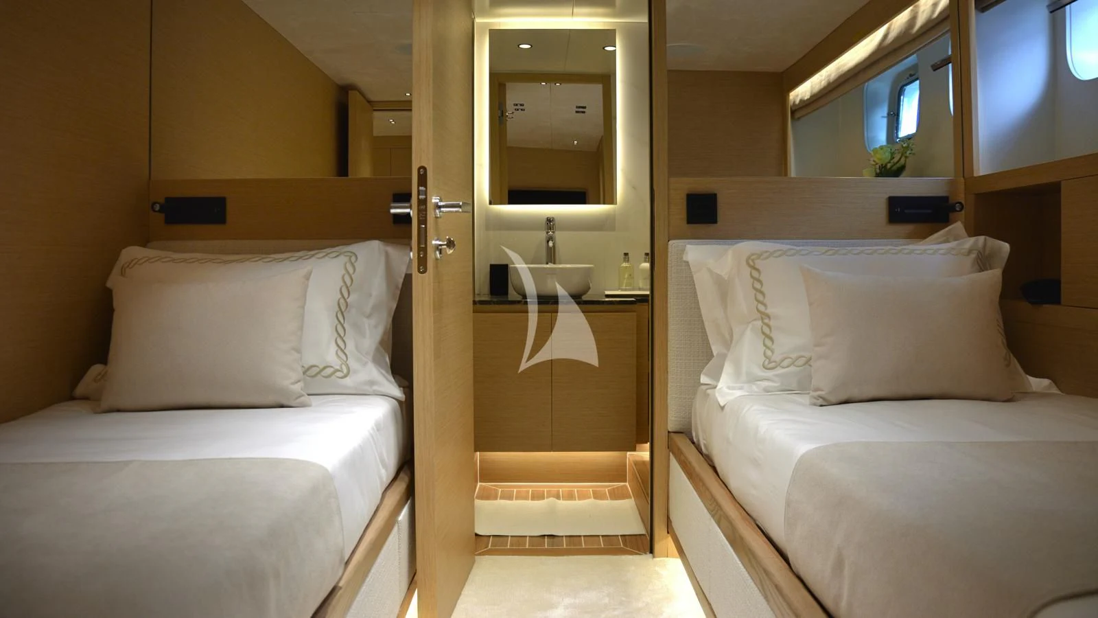 a room with two beds aboard XIPHIAS Yacht for Charter