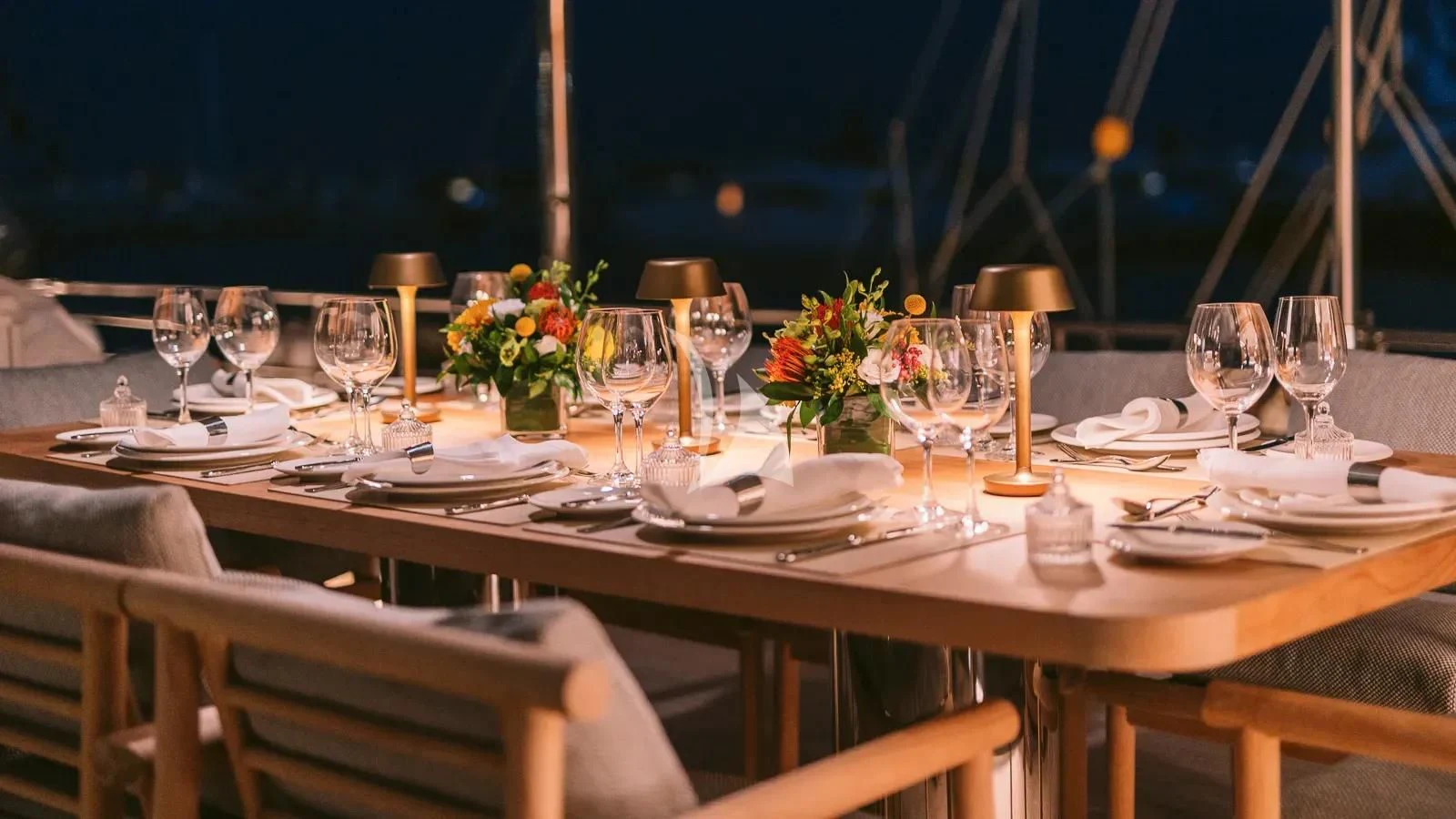 a table set for a dinner aboard XIPHIAS Yacht for Charter