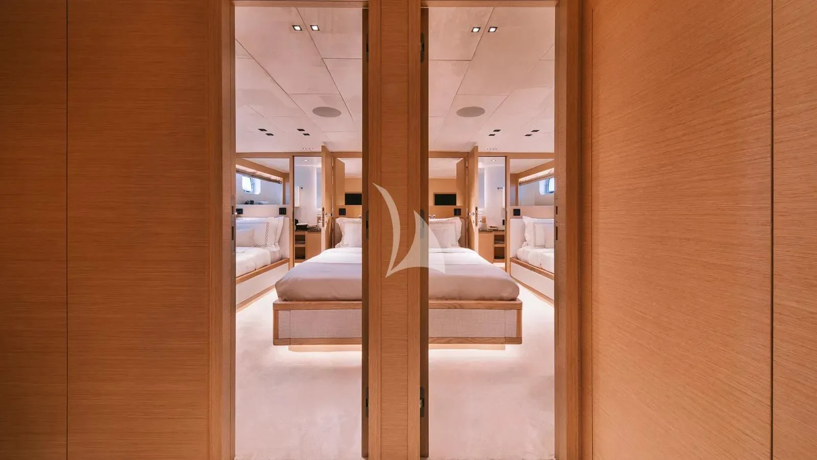 a room with a bed and a door aboard XIPHIAS Yacht for Charter