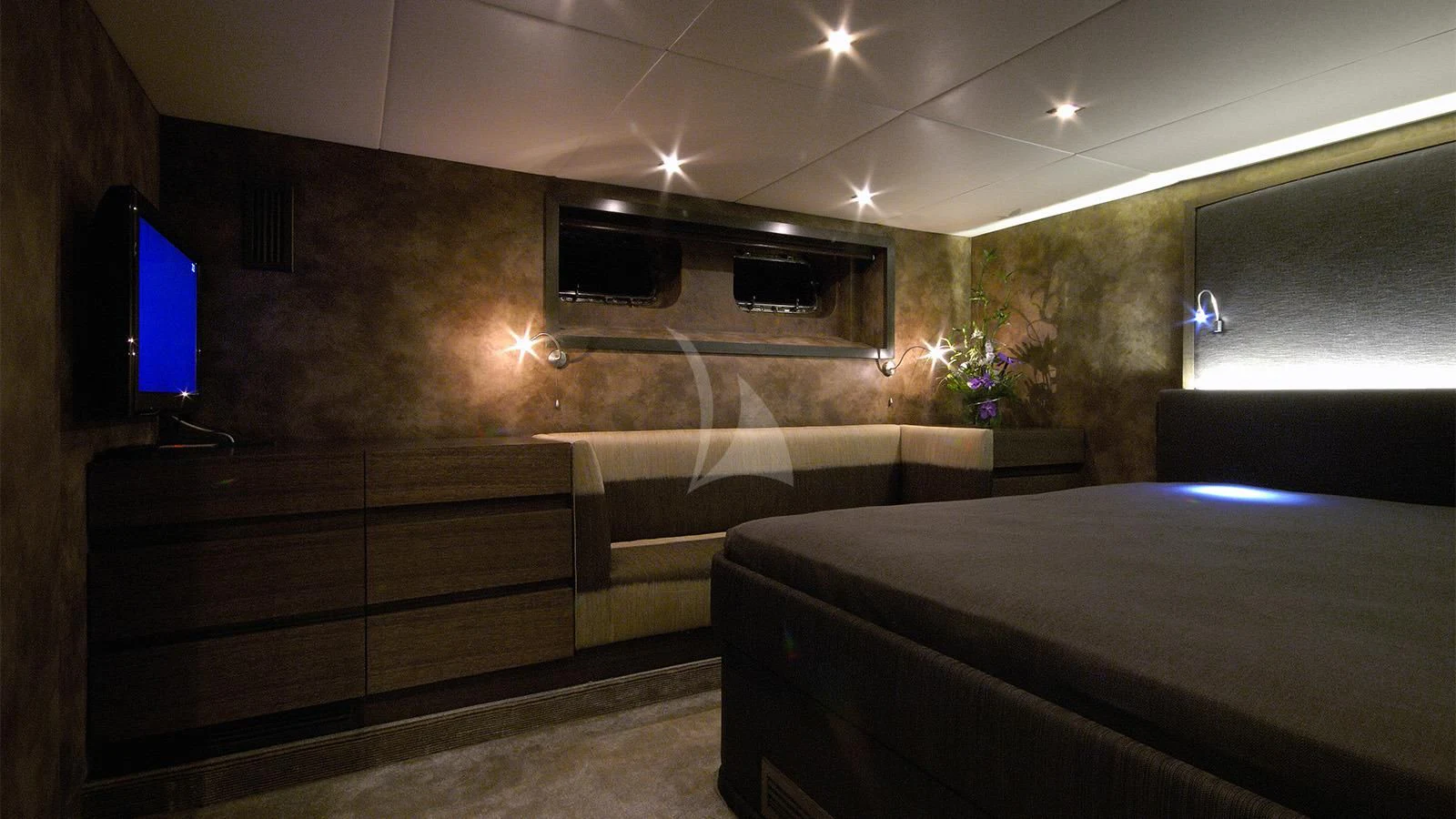 a room with a bed and a tv aboard XIPHIAS Yacht for Charter
