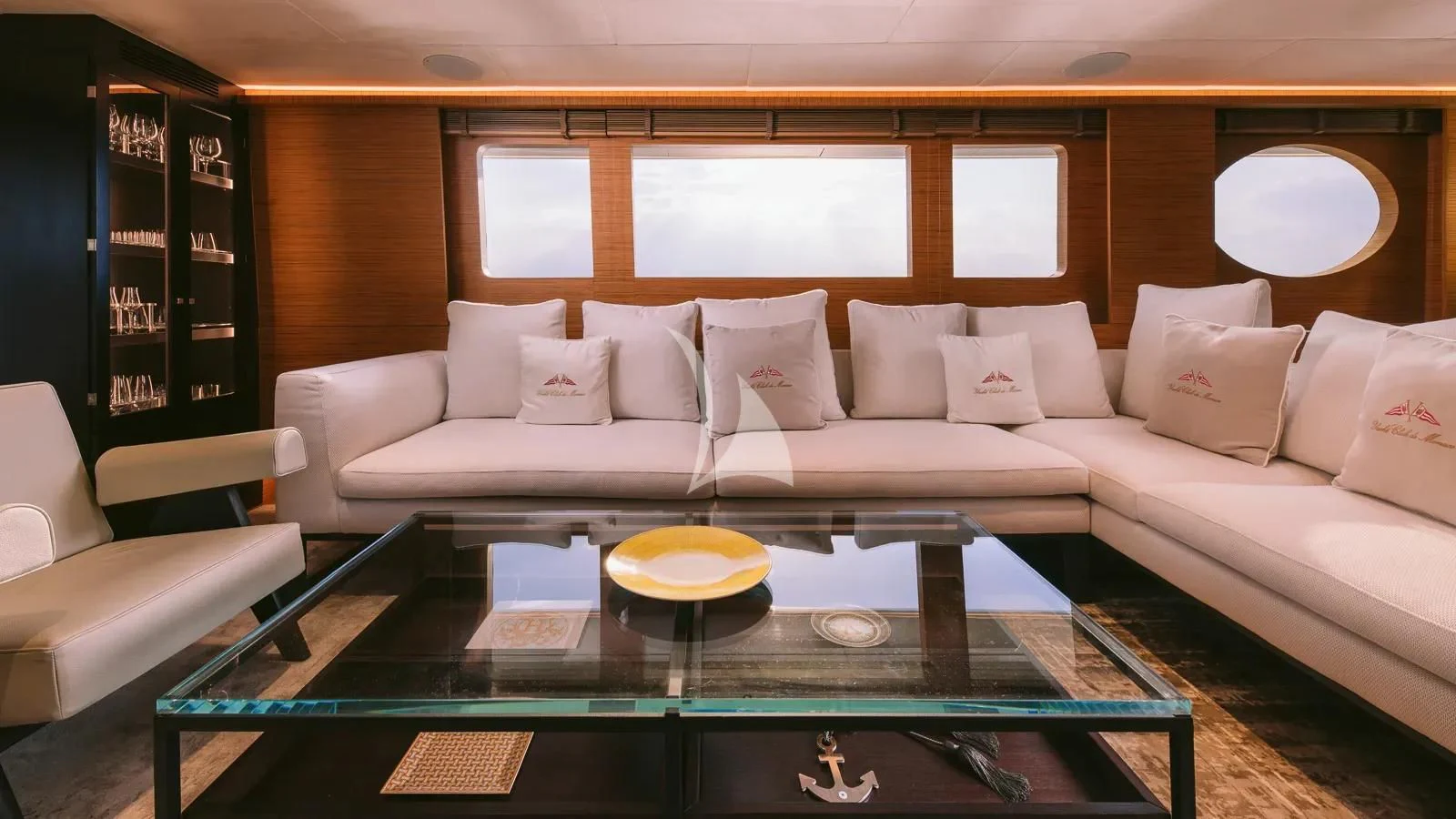 a living room with a white couch and a table aboard XIPHIAS Yacht for Charter