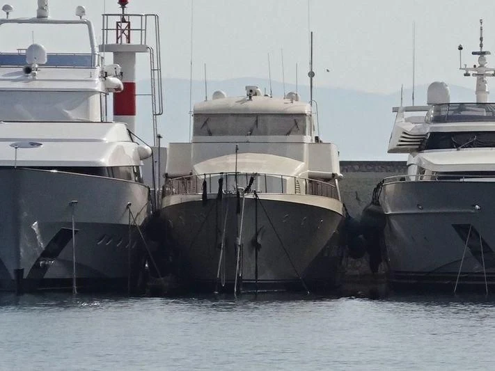 several boats docked at a pier aboard XIPHIAS Yacht for Charter