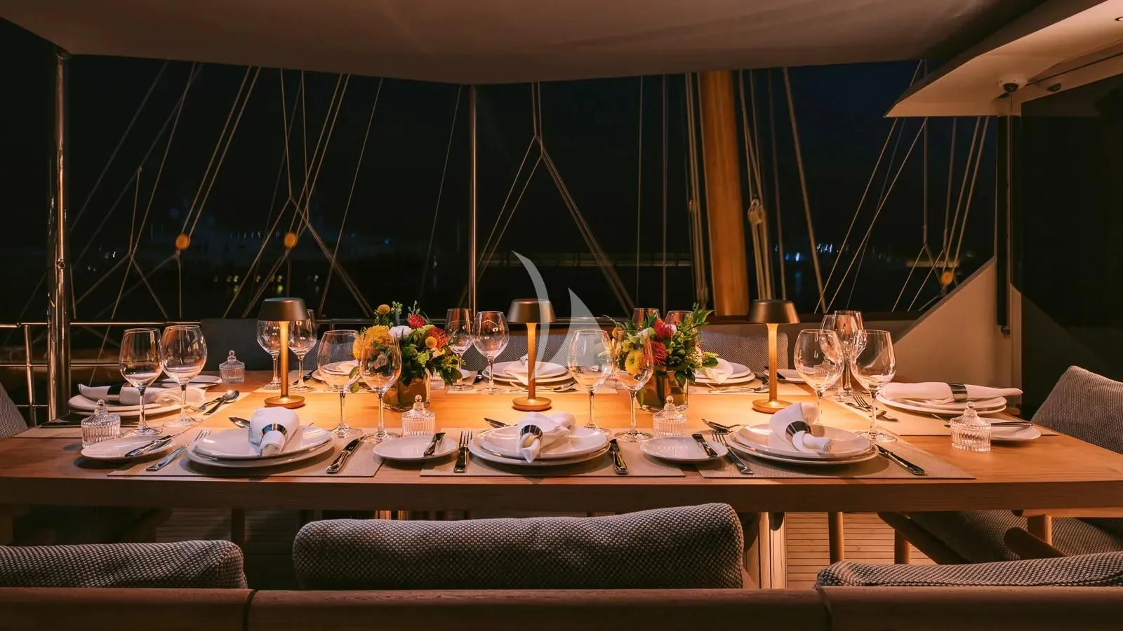 a table set for a dinner aboard XIPHIAS Yacht for Charter