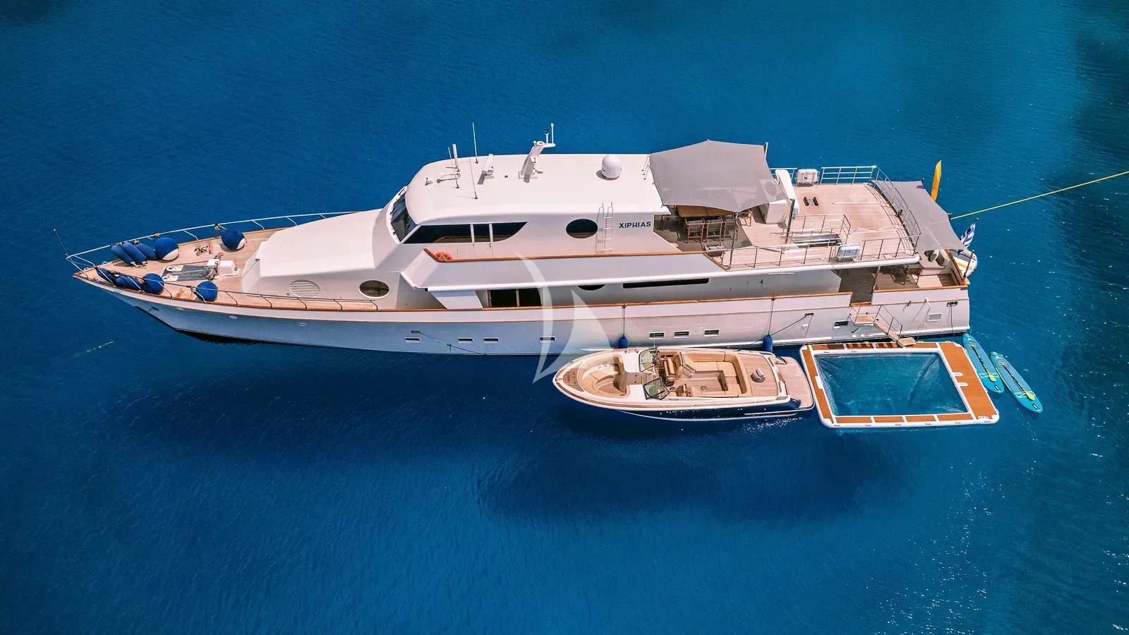 a large white yacht in the water aboard XIPHIAS Yacht for Charter