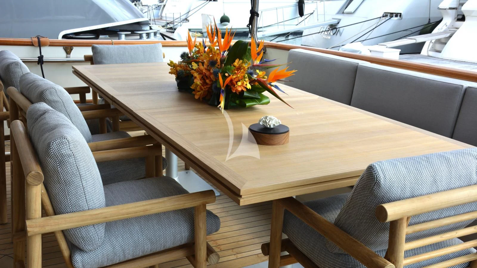 a table with a plant on it aboard XIPHIAS Yacht for Charter
