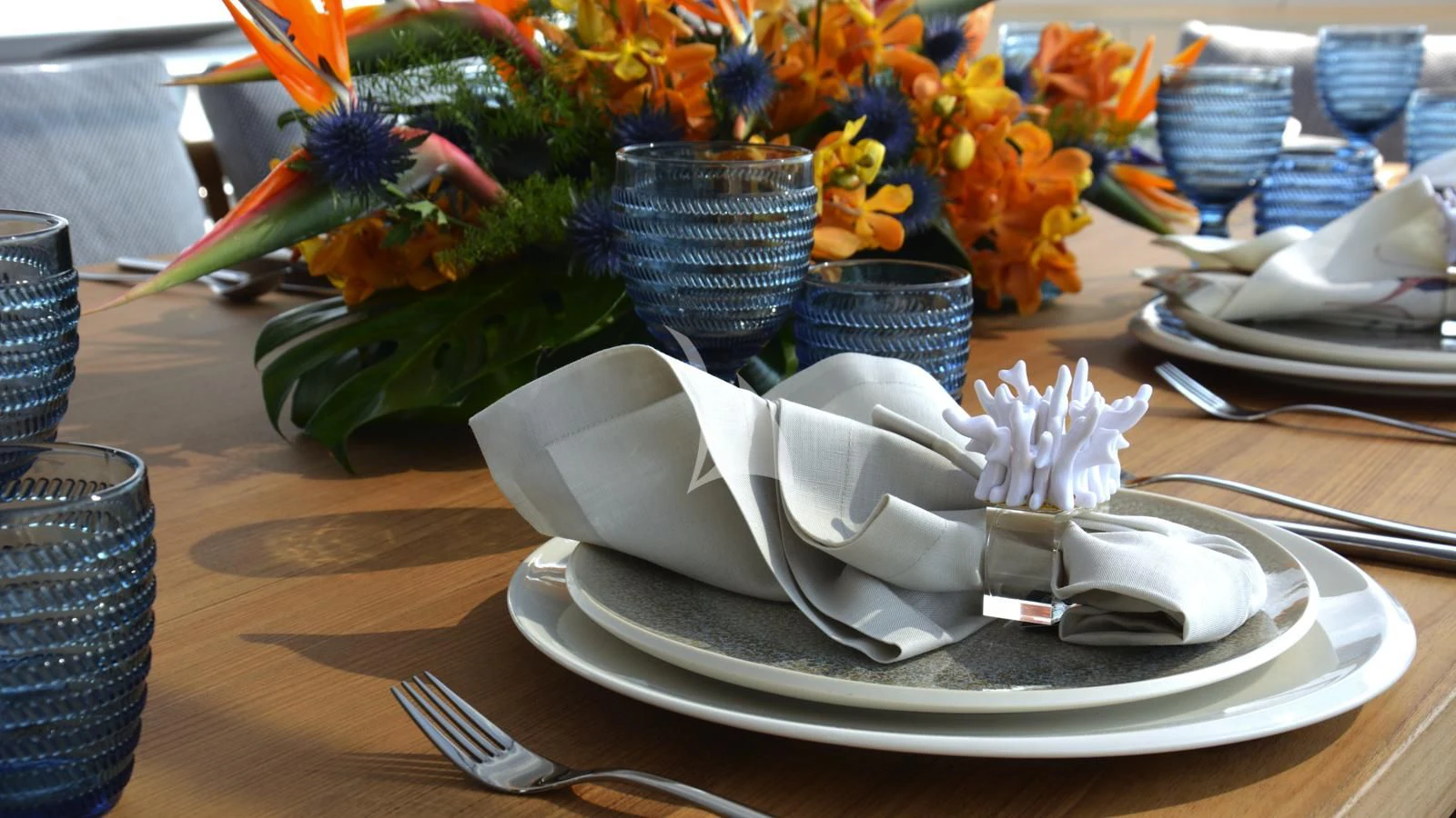a plate with a flower on it aboard XIPHIAS Yacht for Charter