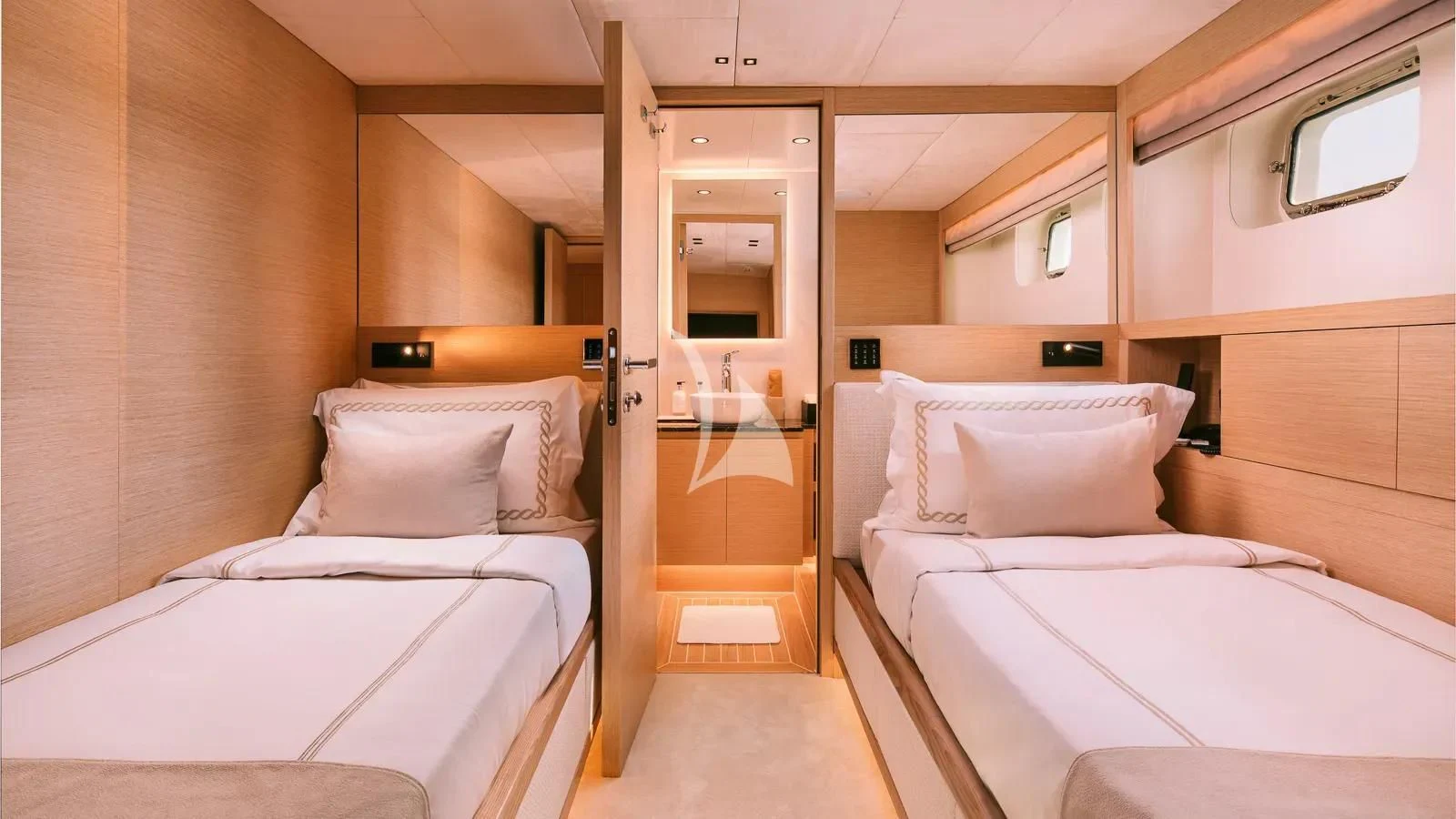 a room with two beds aboard XIPHIAS Yacht for Charter