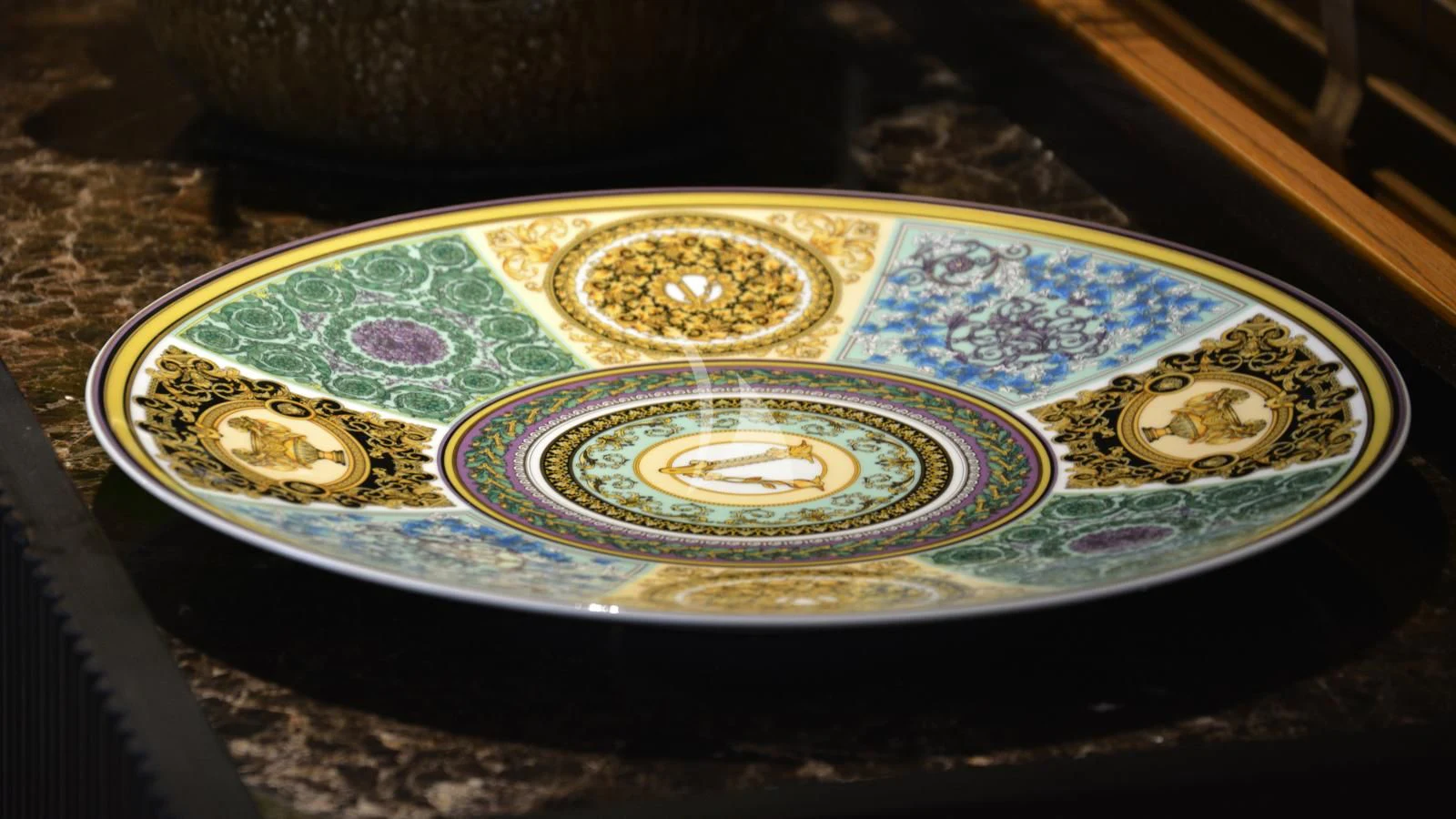 a colorful plate on a wood surface aboard XIPHIAS Yacht for Charter