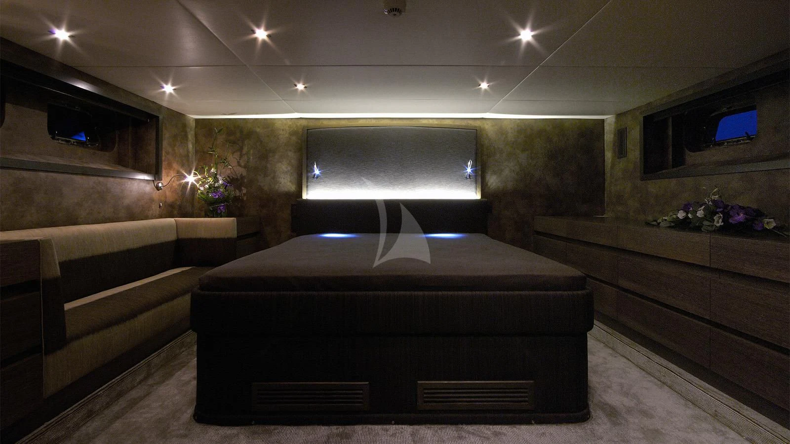 a large bed in a room aboard XIPHIAS Yacht for Charter