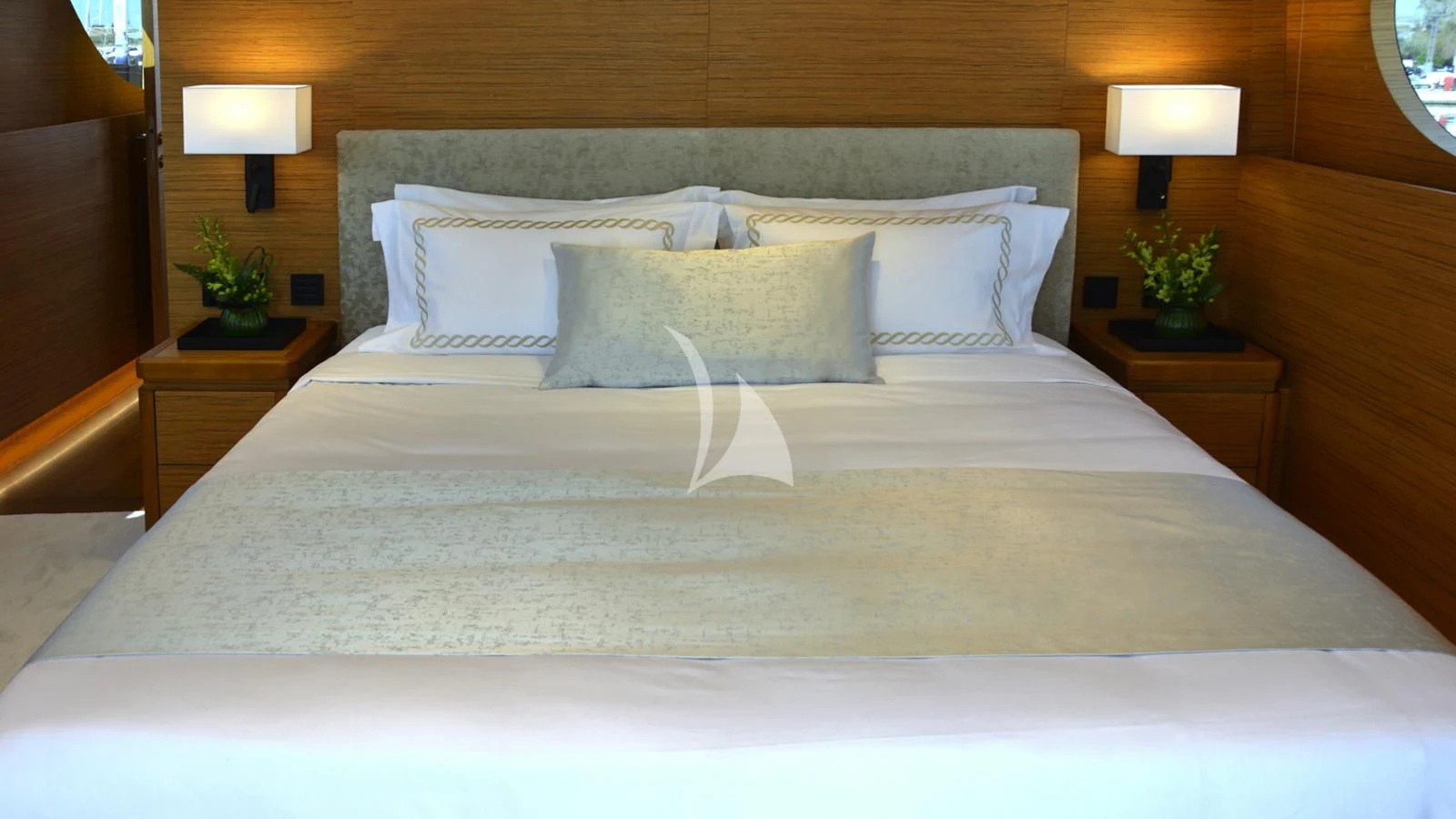 a bed with white sheets aboard XIPHIAS Yacht for Charter