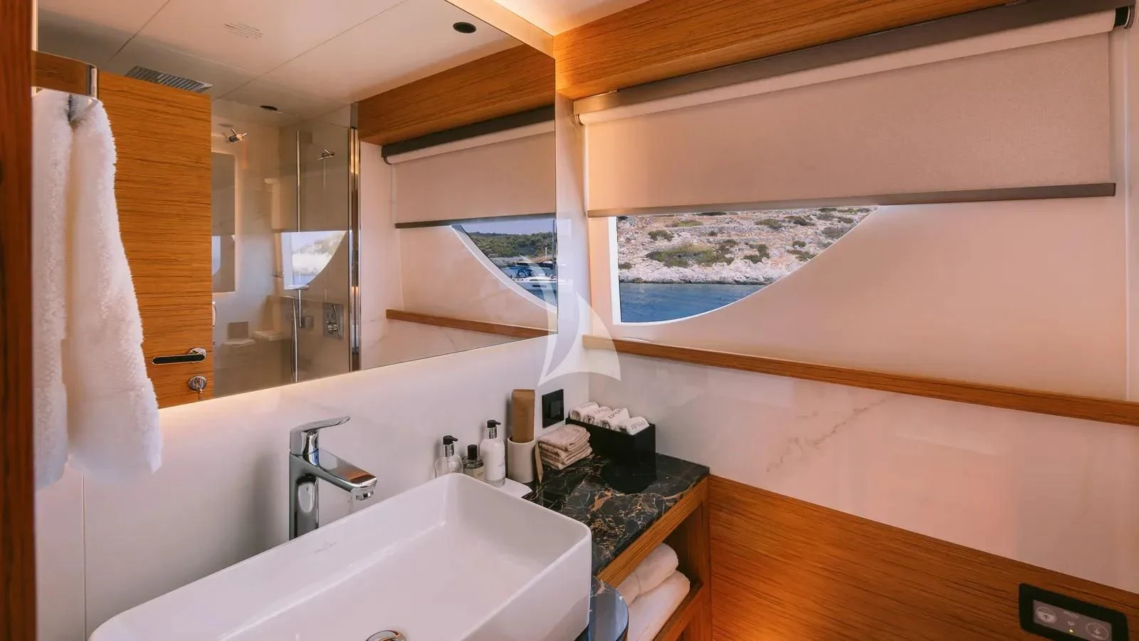 a bathroom with a large mirror aboard XIPHIAS Yacht for Charter