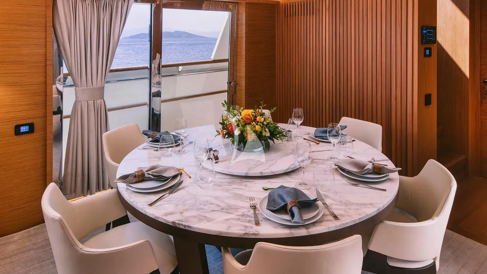 a table set for a dinner aboard XIPHIAS Yacht for Charter