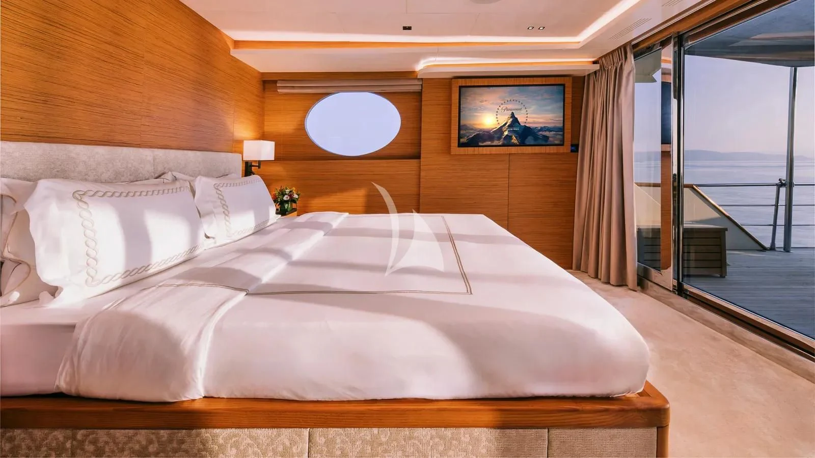 a large bed in a room aboard XIPHIAS Yacht for Charter