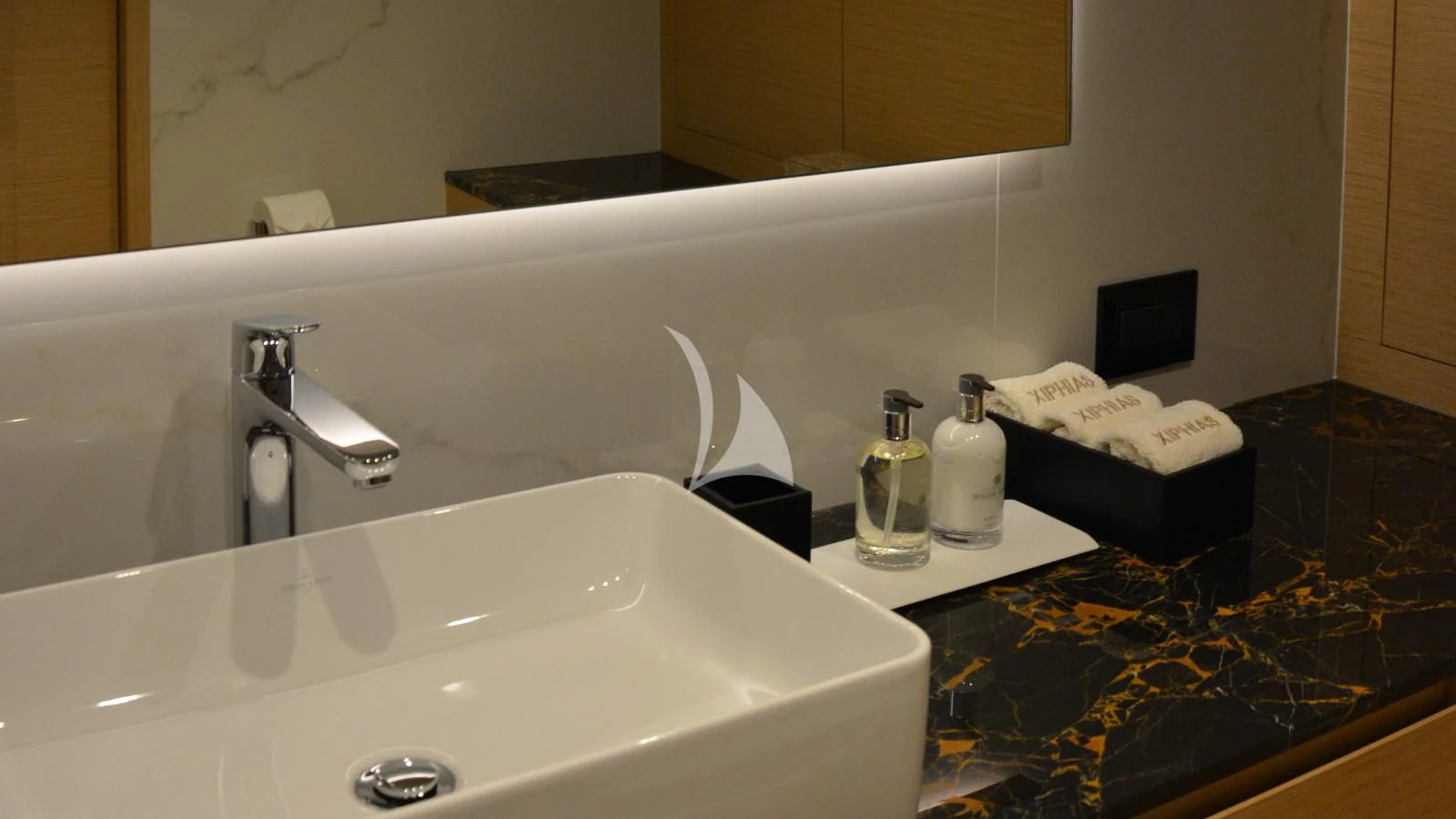 a bathroom sink with a towel on it aboard XIPHIAS Yacht for Charter