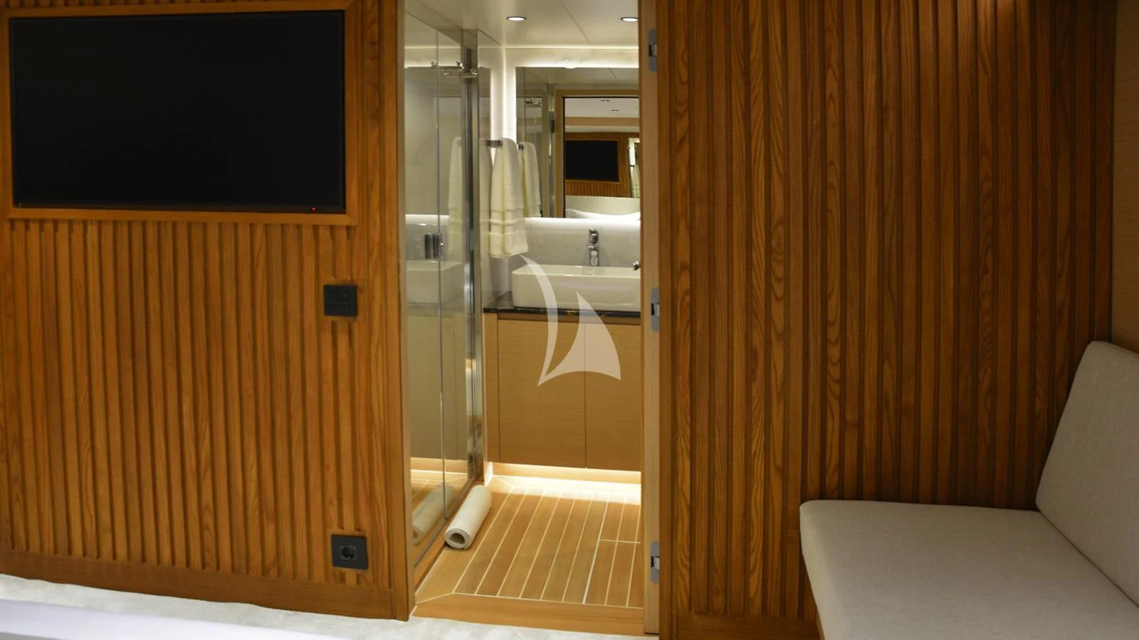 a bathroom with a shower and a couch aboard XIPHIAS Yacht for Charter