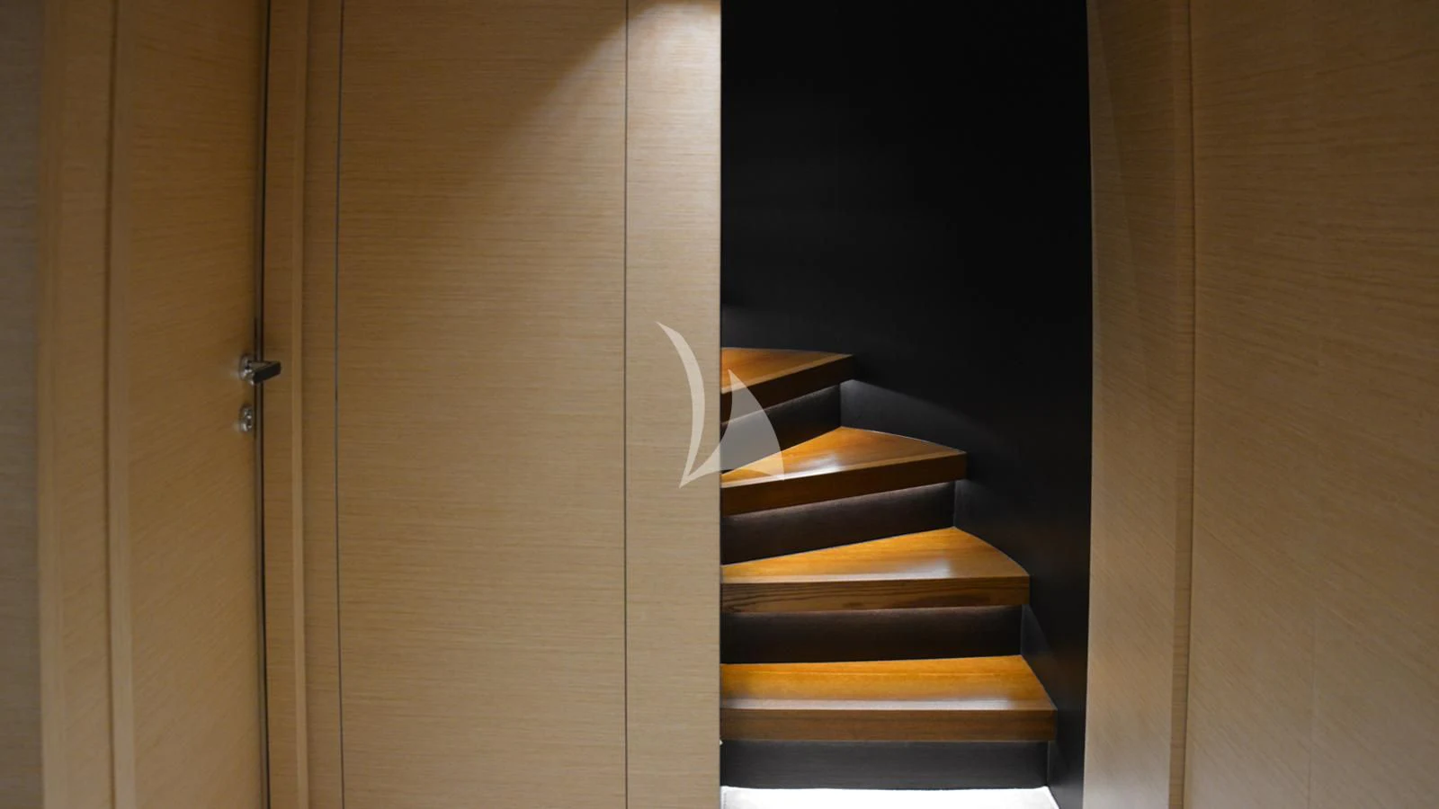 a wooden staircase in a room aboard XIPHIAS Yacht for Charter