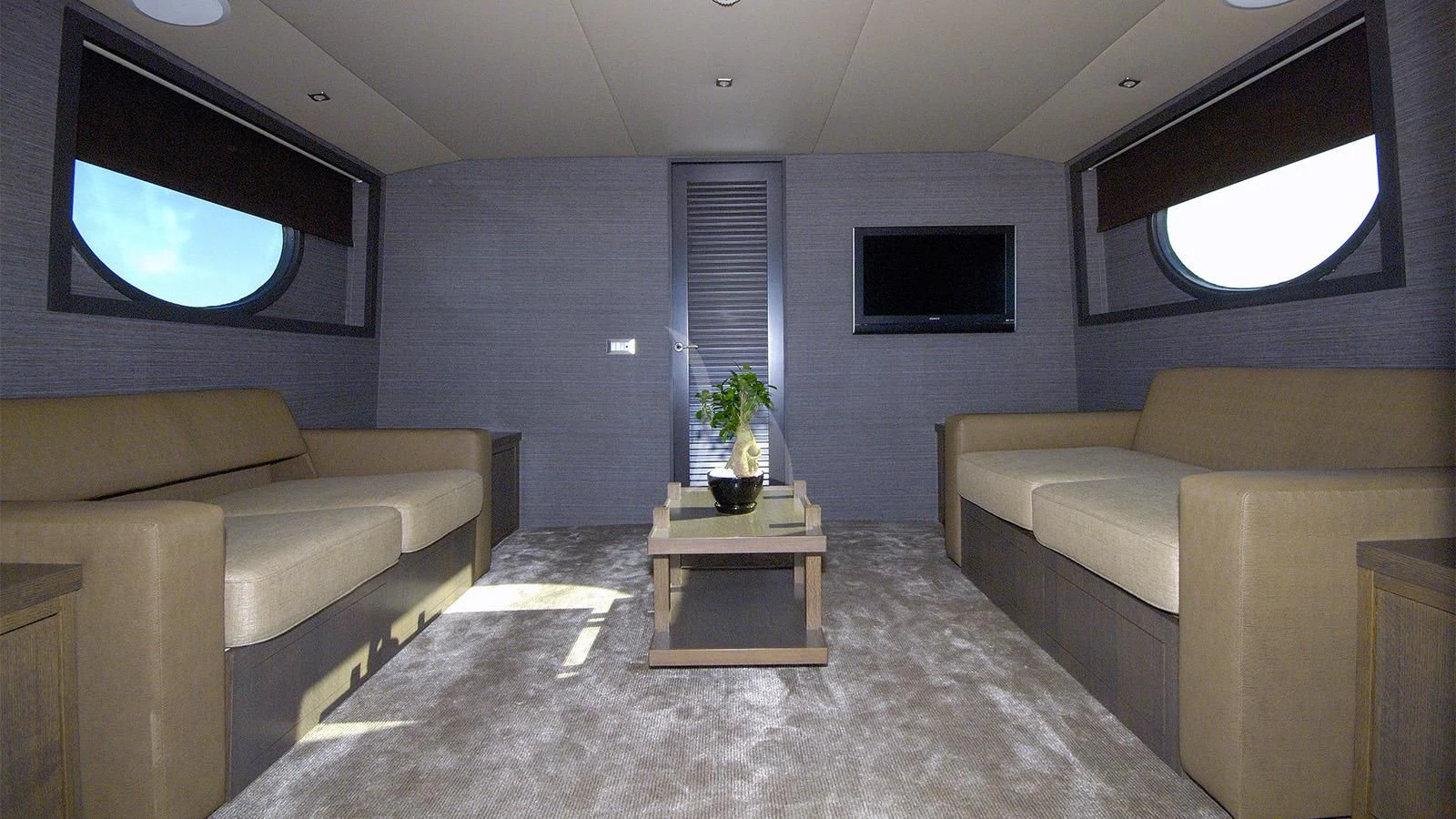 a living room with a couch and a tv aboard XIPHIAS Yacht for Charter