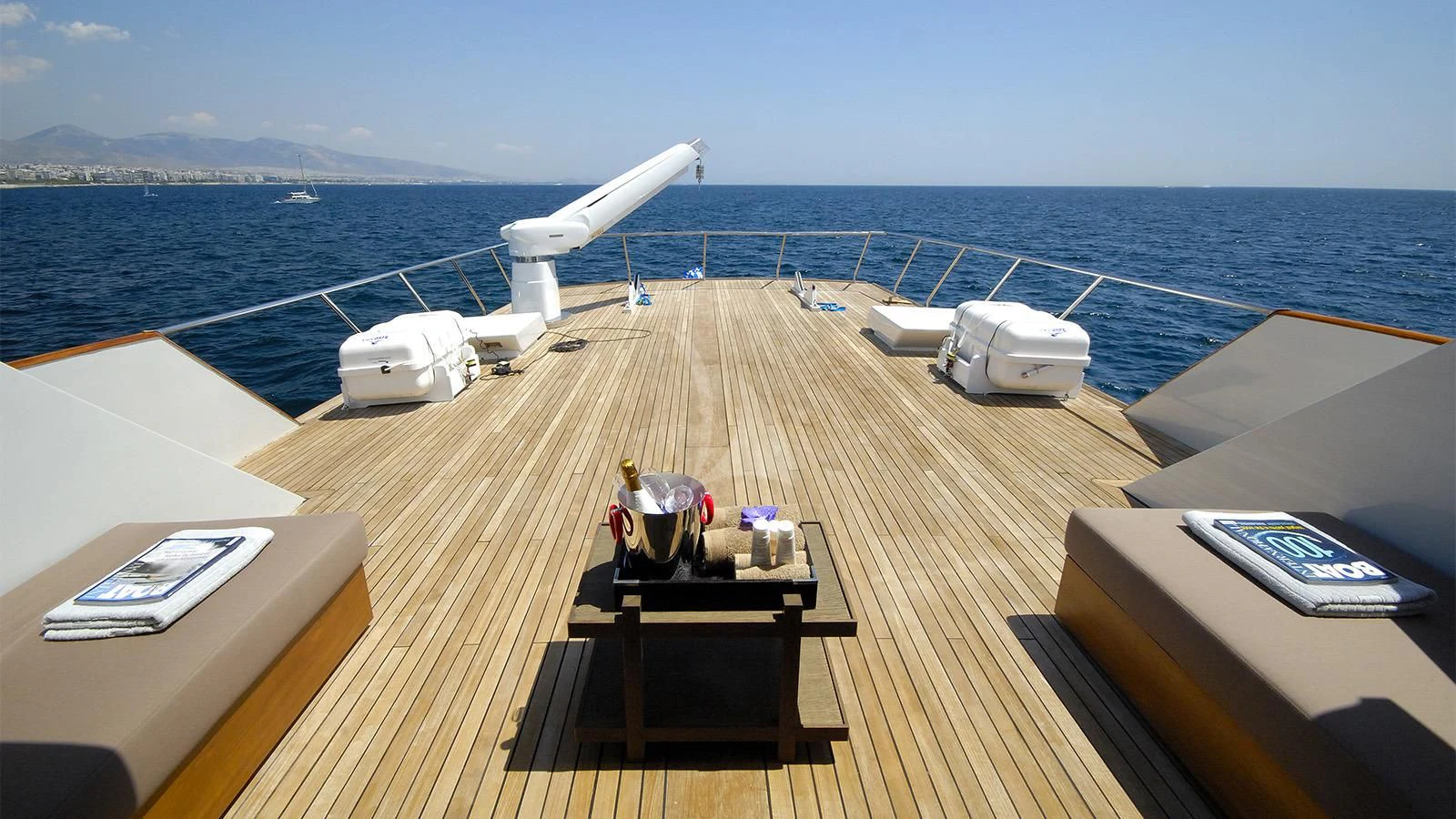 a deck with a boat and a laptop on it aboard XIPHIAS Yacht for Charter