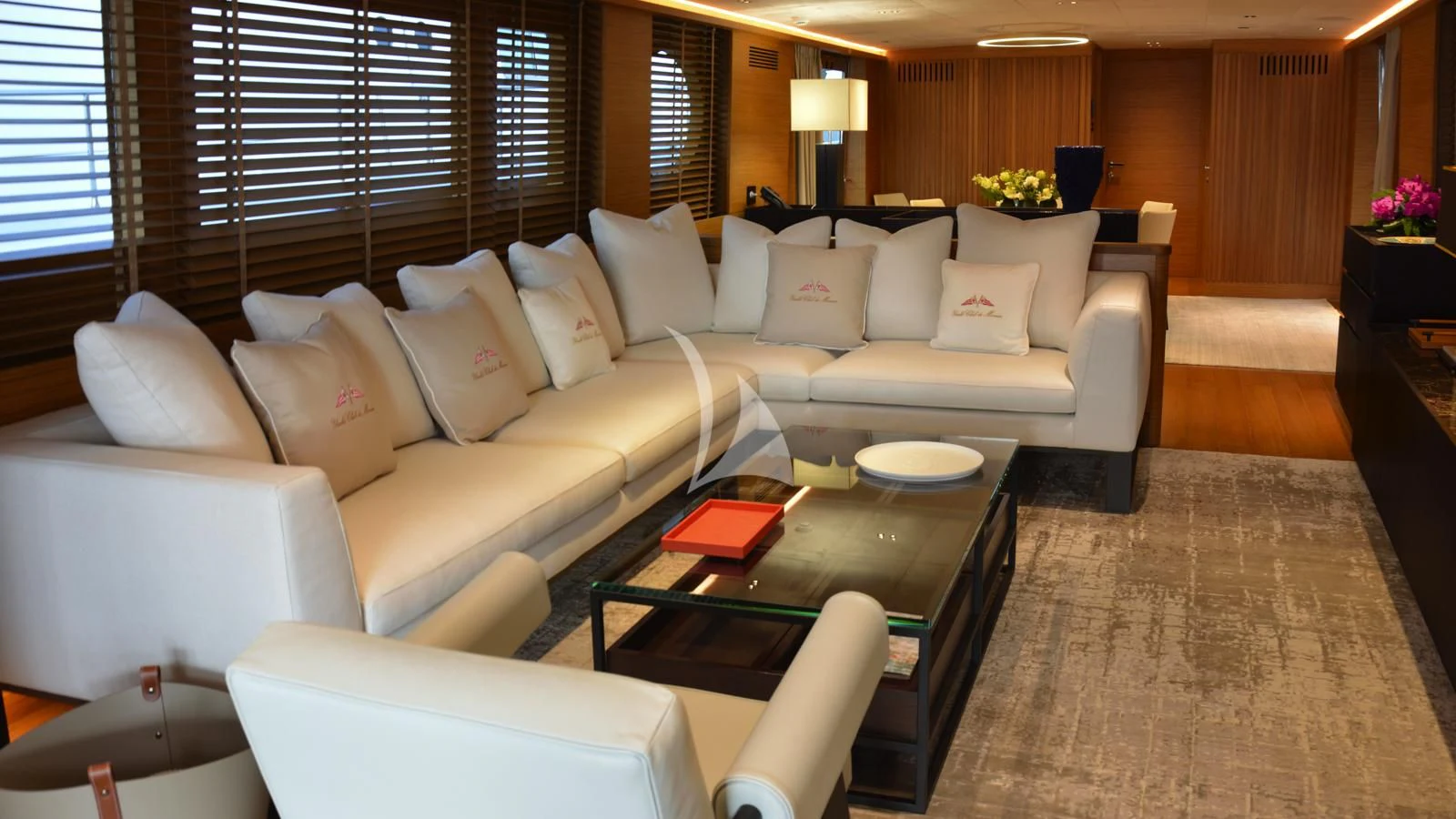 a living room with a couch and a coffee table aboard XIPHIAS Yacht for Charter