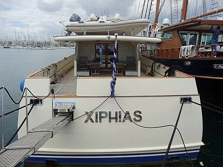 a boat docked at a pier aboard XIPHIAS Yacht for Charter