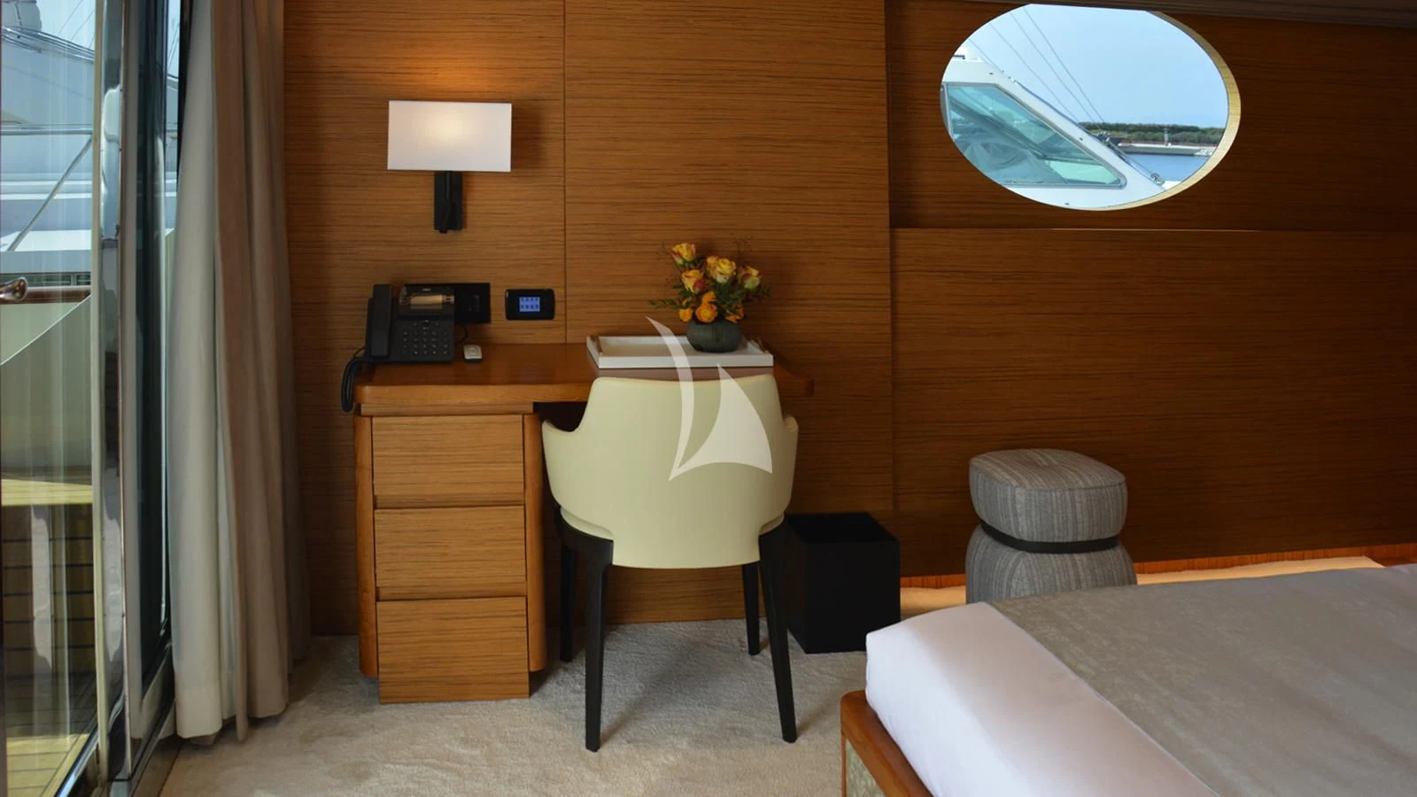 a room with a desk and a chair aboard XIPHIAS Yacht for Charter
