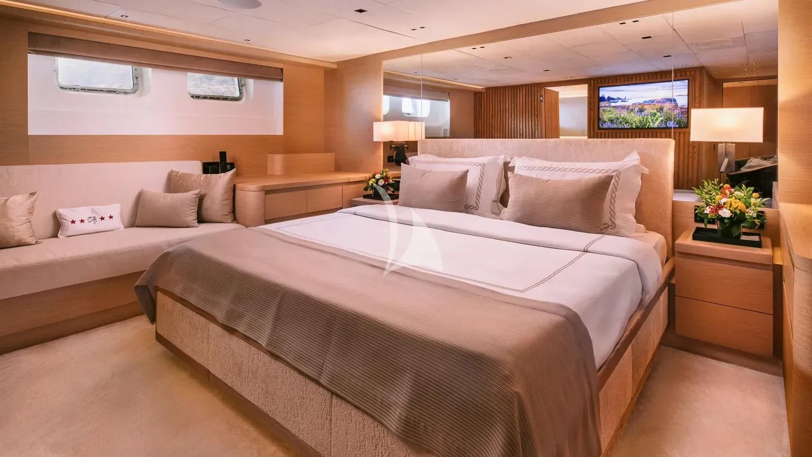 a large bed in a hotel room aboard XIPHIAS Yacht for Charter