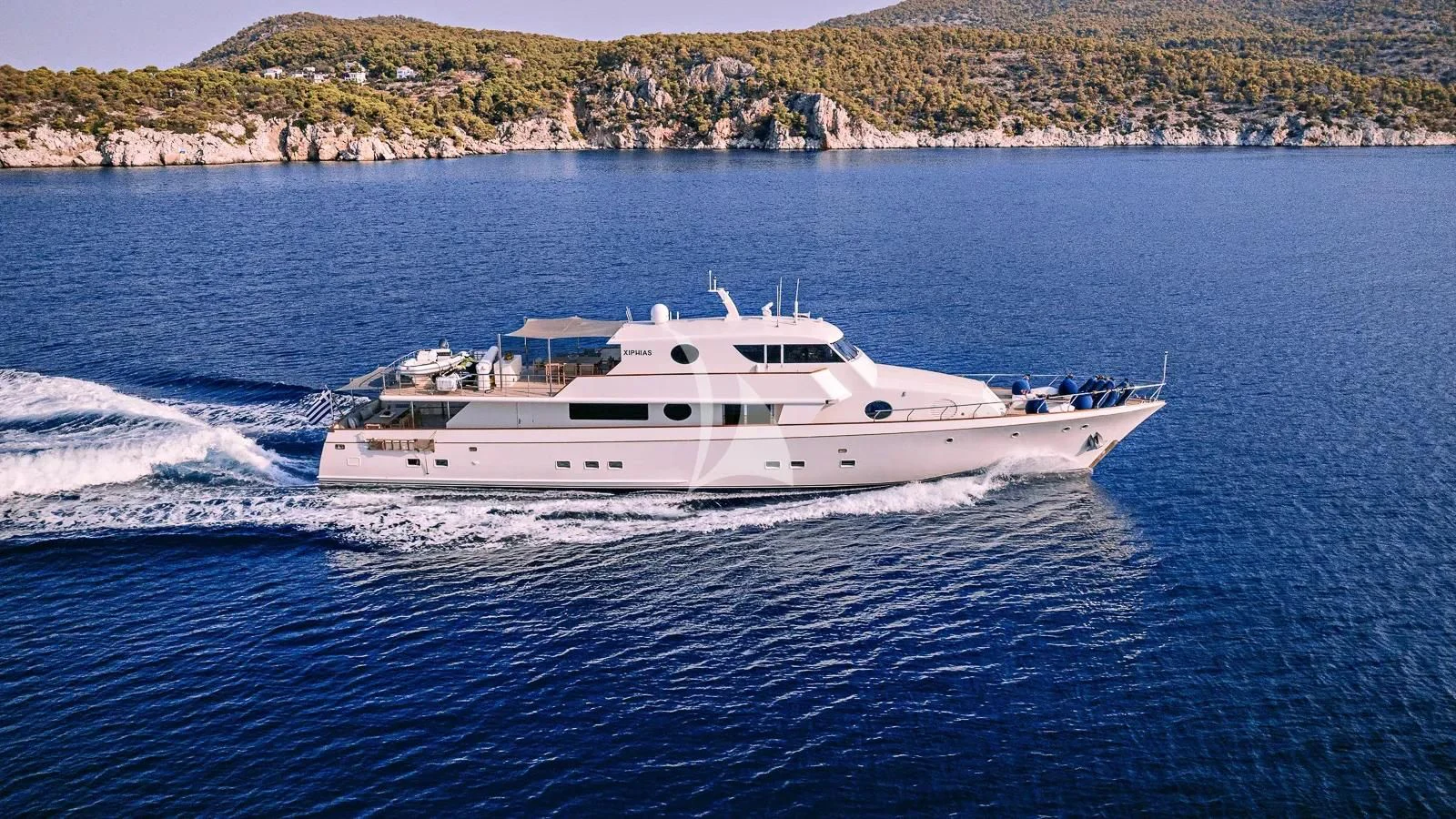 a white yacht on the water aboard XIPHIAS Yacht for Charter