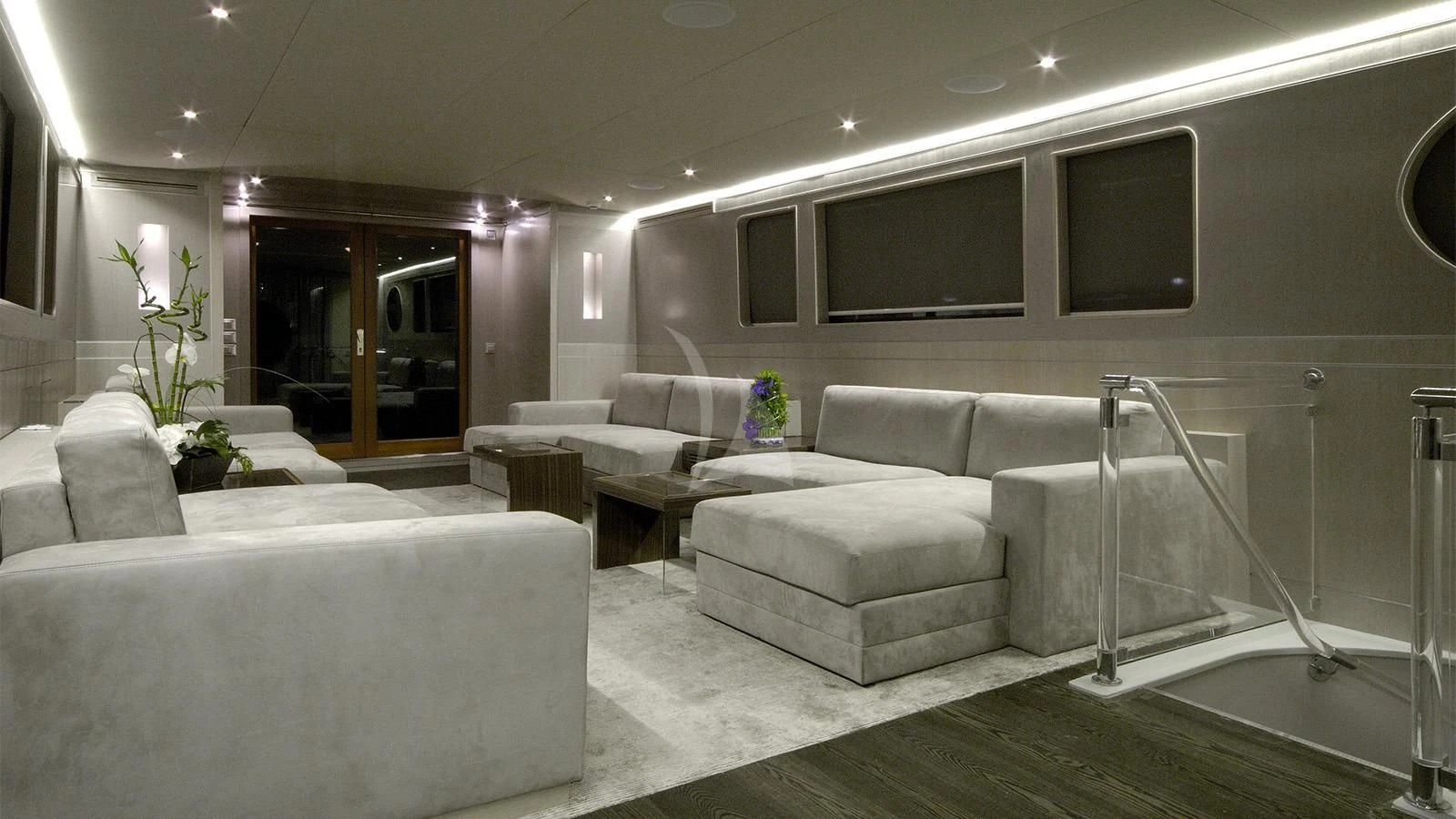 a living room with white couches aboard XIPHIAS Yacht for Charter