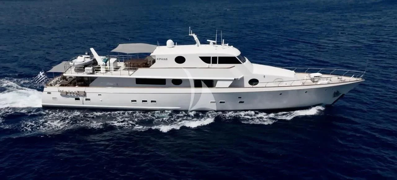 a white yacht in the water aboard XIPHIAS Yacht for Charter