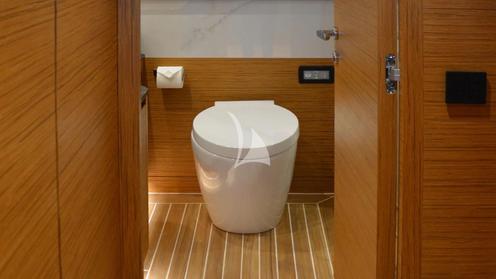 a toilet in a bathroom aboard XIPHIAS Yacht for Charter