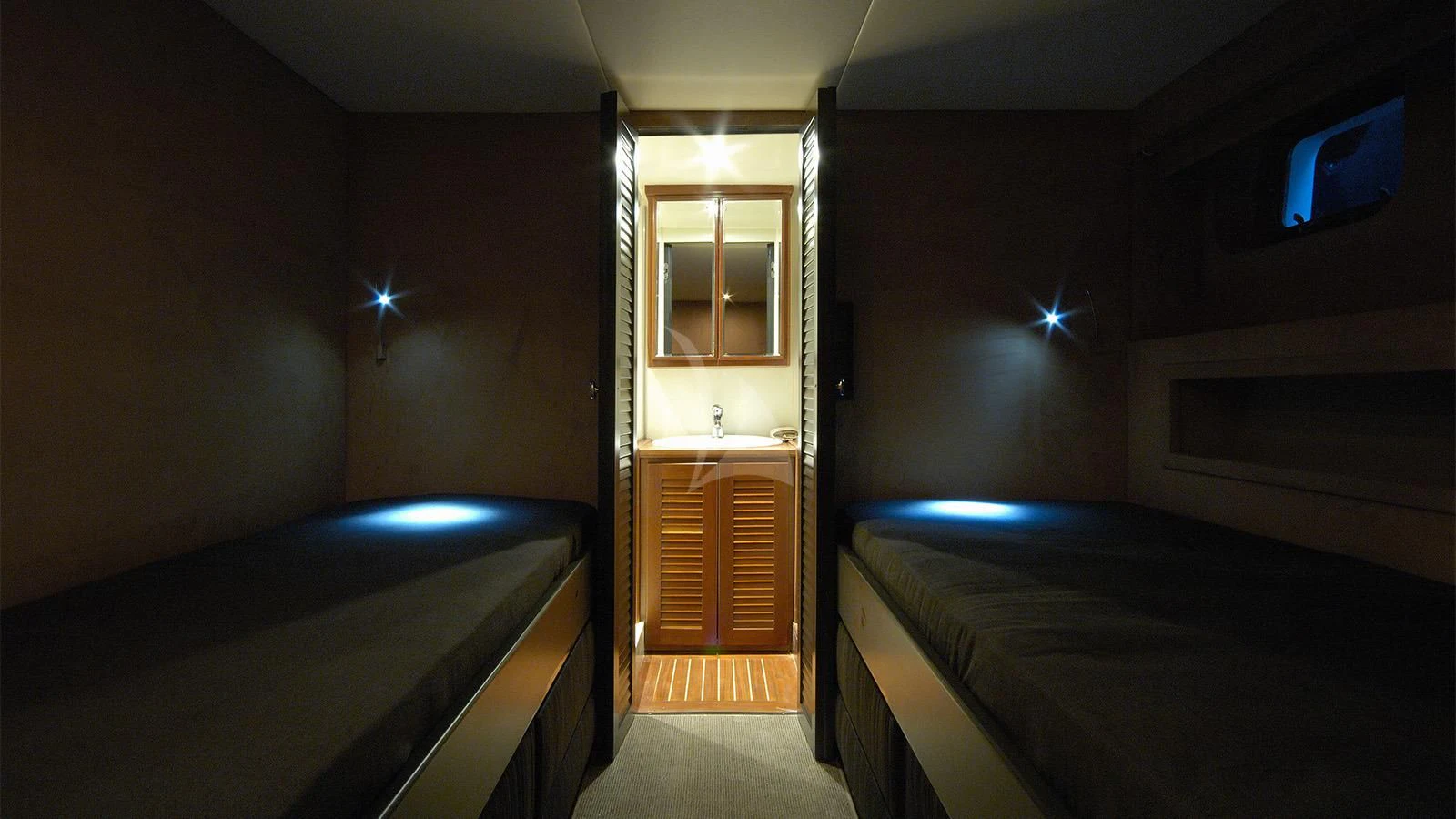 a room with two beds aboard XIPHIAS Yacht for Charter