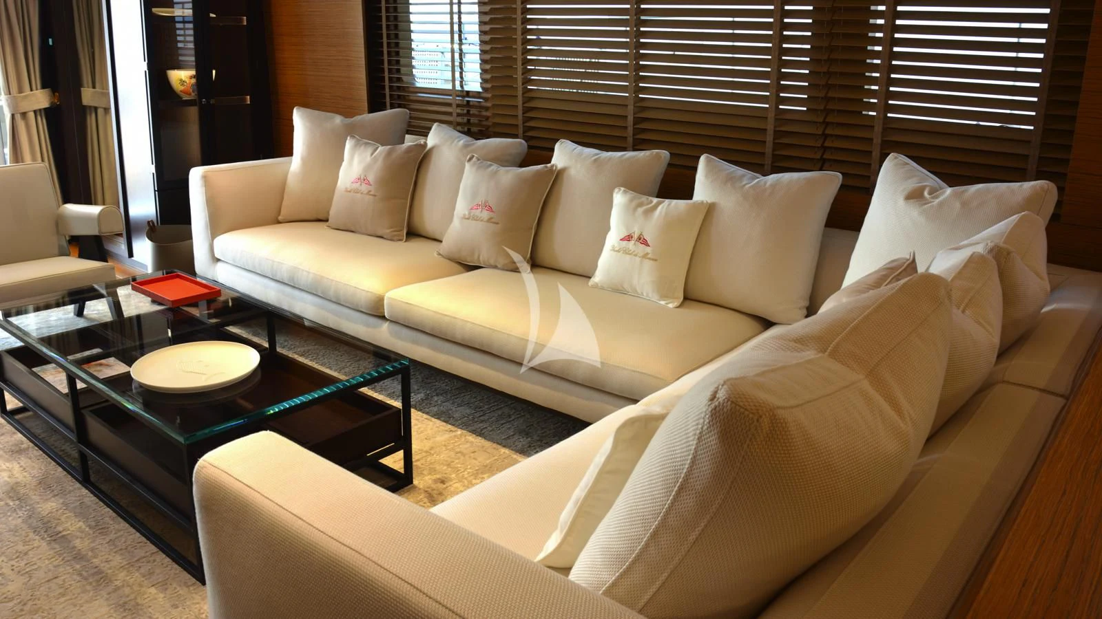 a couch with pillows on it aboard XIPHIAS Yacht for Charter