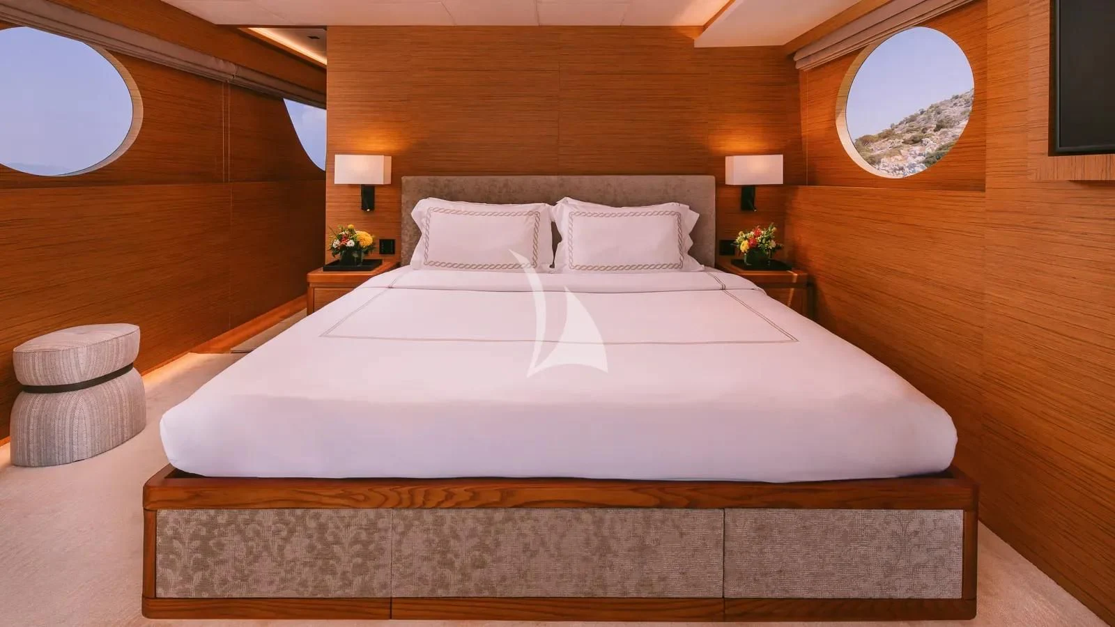 a large bed with white sheets aboard XIPHIAS Yacht for Charter