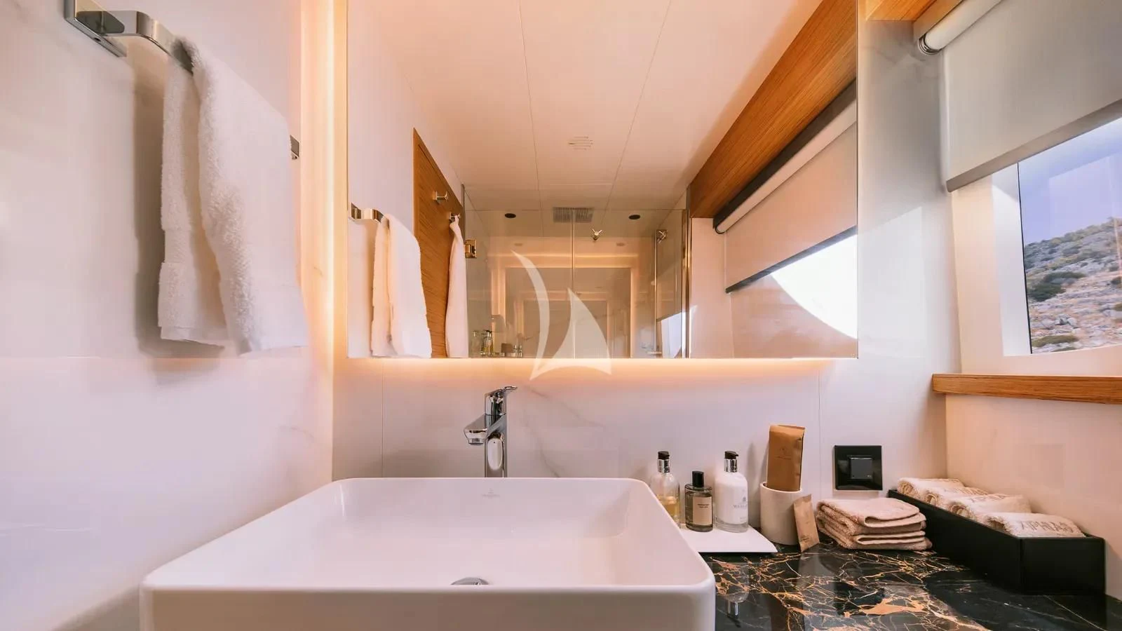 a bathroom with a large mirror aboard XIPHIAS Yacht for Charter