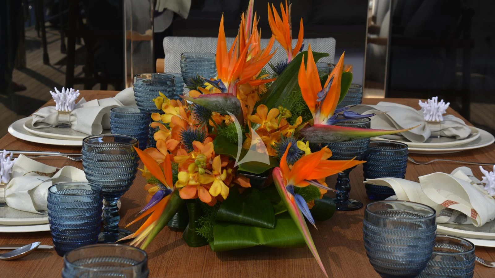 a table with plates and bowls of food on it aboard XIPHIAS Yacht for Charter