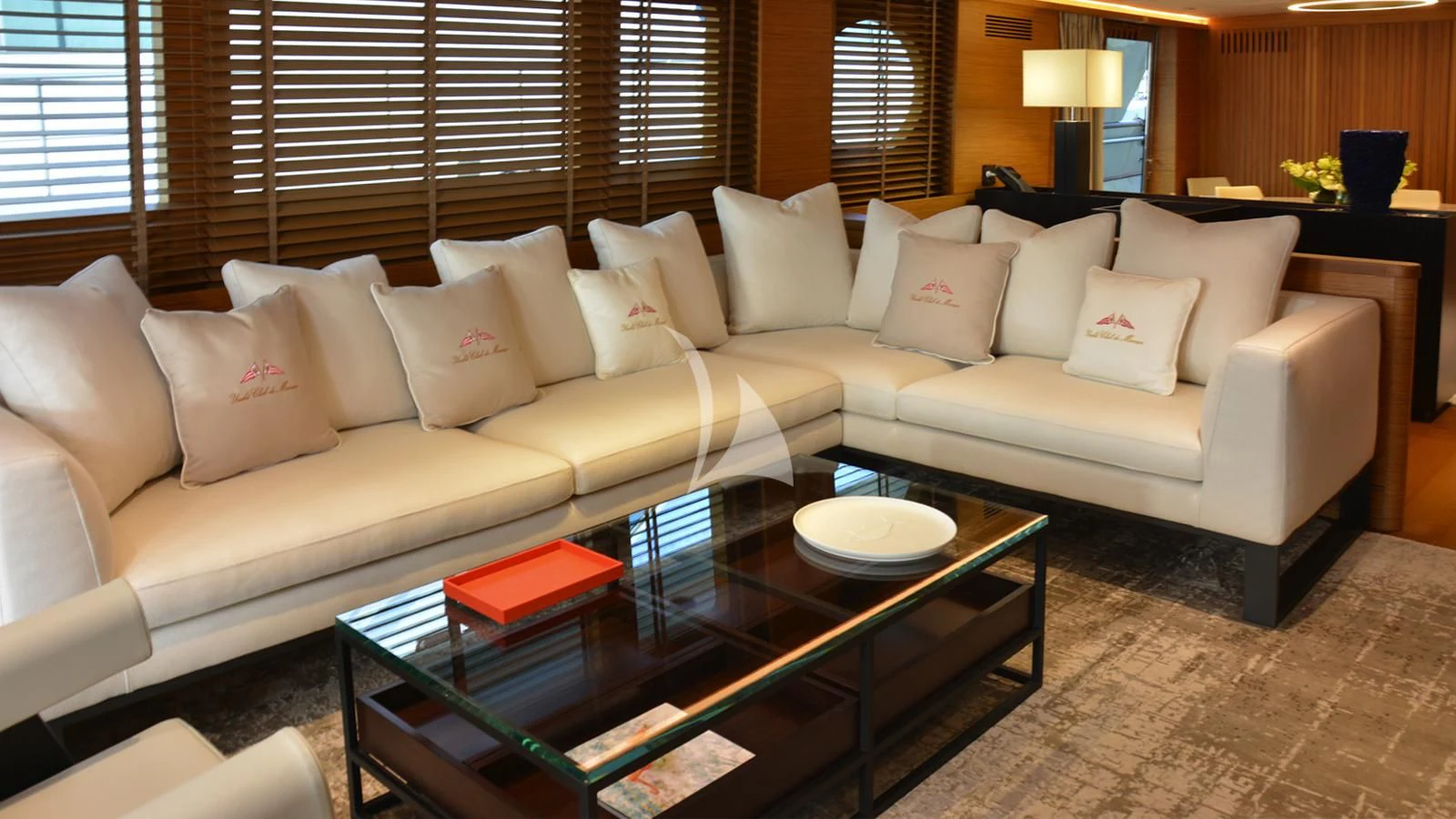 a living room with a couch and coffee table aboard XIPHIAS Yacht for Charter